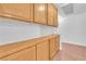 Hallway with built-in cabinets and light wood-style flooring at 2753 Trickling Brook Ct, Las Vegas, NV 89156