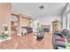 Spacious living room features a brick fireplace, hardwood floors, and neutral paint at 2753 Trickling Brook Ct, Las Vegas, NV 89156
