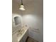 Bathroom featuring a vanity with a mirror and a classic lighting fixture at 2804 E Gowan Rd, North Las Vegas, NV 89030