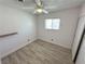 This bedroom offers tiled flooring, a ceiling fan, and a window for natural light at 2804 E Gowan Rd, North Las Vegas, NV 89030