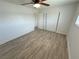 Simple bedroom featuring wood-look tile flooring and a closet at 2804 E Gowan Rd, North Las Vegas, NV 89030