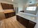 Open kitchen featuring stainless steel appliances, wood cabinetry, and tiled flooring at 2804 E Gowan Rd, North Las Vegas, NV 89030