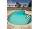 Inviting backyard pool with stairs and concrete surroundings perfect for relaxation at 2804 E Gowan Rd, North Las Vegas, NV 89030