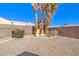 Fenced backyard features play structure, mature landscaping, and plenty of room for activities at 2809 Mountain Violet Ct, Las Vegas, NV 89108