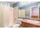 Blue bathroom with tub and shower, toilet, and vanity at 2809 Mountain Violet Ct, Las Vegas, NV 89108