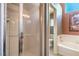 Bright bathroom with a tiled shower, toilet, and soaking tub adjacent to the shower at 2809 Mountain Violet Ct, Las Vegas, NV 89108