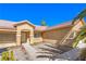 Inviting home showcasing a well-manicured yard, desert landscaping, and a welcoming entrance at 2809 Mountain Violet Ct, Las Vegas, NV 89108