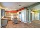Spacious kitchen with light wood cabinetry, appliances, and center island with tile floors at 2809 Mountain Violet Ct, Las Vegas, NV 89108