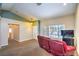 Comfortable living room features neutral walls, carpet, and a large window at 2809 Mountain Violet Ct, Las Vegas, NV 89108