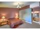 Comfortable primary bedroom features a large bed and ensuite bathroom at 2809 Mountain Violet Ct, Las Vegas, NV 89108
