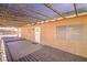 Covered patio with wooden decking and access to the backyard at 2809 Mountain Violet Ct, Las Vegas, NV 89108