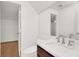 Modern bathroom featuring a white marble countertop and ample mirror space at 2873 Cambretto Dr, Henderson, NV 89074
