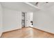 Bright bedroom featuring hardwood floors, closet, and view to a bathroom at 2873 Cambretto Dr, Henderson, NV 89074