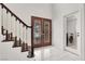 Entryway with decorative glass doors, staircase, and access to laundry room at 2873 Cambretto Dr, Henderson, NV 89074