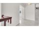 Hallway with white walls, tile flooring, and staircase at 2873 Cambretto Dr, Henderson, NV 89074