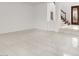 Empty living room boasts tile floors, a split-level entry and open layout at 2873 Cambretto Dr, Henderson, NV 89074