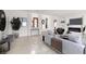 Bright living room with modern fireplace, stylish furniture, and tile flooring at 2873 Cambretto Dr, Henderson, NV 89074