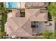 Aerial view of a well maintained home featuring neutral roof tiles, landscaping, and a sparkling blue pool at 2933 Red Springs Dr, Las Vegas, NV 89135