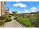 Professionally landscaped yard with desert landscape, grass and a view of the golf course at 2933 Red Springs Dr, Las Vegas, NV 89135
