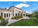 Beautiful home featuring a landscaped backyard, covered patio, and second-story balcony at 2933 Red Springs Dr, Las Vegas, NV 89135