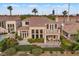 Landscaped backyard featuring lush greenery, an outdoor seating area, and picturesque views at 2933 Red Springs Dr, Las Vegas, NV 89135