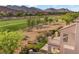 A balcony overlooks the backyard with golf course views and desert landscape, creating a serene outdoor space at 2933 Red Springs Dr, Las Vegas, NV 89135