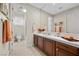 Bathroom with tile flooring, wood cabinets, framed mirror and neutral wall color at 2933 Red Springs Dr, Las Vegas, NV 89135