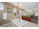 Elegant bathroom features a soaking tub, dark wood cabinets, and large mirror at 2933 Red Springs Dr, Las Vegas, NV 89135
