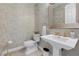 Stylish half bath with a pedestal sink, decorative walls, and elegant fixtures at 2933 Red Springs Dr, Las Vegas, NV 89135