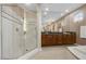 Spacious primary bath features glass-enclosed shower, double vanity, tile flooring, and granite countertop at 2933 Red Springs Dr, Las Vegas, NV 89135