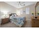 Bedroom featuring a patterned bedspread, side table, and a window with shutters at 2933 Red Springs Dr, Las Vegas, NV 89135