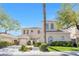Charming stucco two-story home with well-manicured landscaping and a two-car garage in a sunny neighborhood at 2933 Red Springs Dr, Las Vegas, NV 89135
