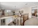 Bright hallway with railing overlooking the entry and a bedroom view boasts natural light and elegant design at 2933 Red Springs Dr, Las Vegas, NV 89135