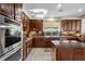 Gourmet kitchen with an oven, a center island, and granite countertops at 2933 Red Springs Dr, Las Vegas, NV 89135