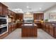 Spacious kitchen boasts wood cabinets, granite countertops, and modern appliances at 2933 Red Springs Dr, Las Vegas, NV 89135