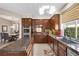 Well-equipped kitchen featuring sleek appliances, granite countertops, and custom cabinetry at 2933 Red Springs Dr, Las Vegas, NV 89135