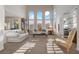 Bright living room with high ceilings, tall windows, mountain views, and elegant furniture at 2933 Red Springs Dr, Las Vegas, NV 89135
