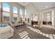 Spacious living room featuring high ceilings, arched windows, plush seating, and stylish decor at 2933 Red Springs Dr, Las Vegas, NV 89135