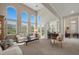 Bright living room with golf course views, bar, and comfortable seating arrangements at 2933 Red Springs Dr, Las Vegas, NV 89135