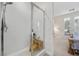 Bright bathroom features a glass-enclosed shower with white tile and a view into an adjacent bedroom with light streaming through at 2933 Red Springs Dr, Las Vegas, NV 89135