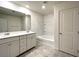 Bright bathroom with double vanity, ample storage, and a shower-tub combination at 2970 Saltillo Ln, Las Vegas, NV 89121