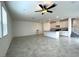 Open-concept living room with a kitchen, tile flooring and ample natural light at 2970 Saltillo Ln, Las Vegas, NV 89121