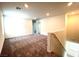 Open loft area with neutral carpet and natural lighting at 2970 Saltillo Ln, Las Vegas, NV 89121
