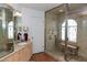 Elegant bathroom featuring a glass-enclosed shower with a built-in bench and granite tile surround at 3008 Blue Fin Cir, Las Vegas, NV 89128