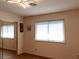 Bright bedroom featuring wood-look floors, a large closet and a large window at 3008 Blue Fin Cir, Las Vegas, NV 89128