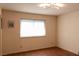 Bright, cozy bedroom with wood floors and a neutral color palette at 3008 Blue Fin Cir, Las Vegas, NV 89128