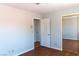 This bedroom features wood floors, base trim and a mirrored closet at 3008 Blue Fin Cir, Las Vegas, NV 89128