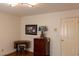 Bedroom with vintage sewing machine and display shelf next to door at 3008 Blue Fin Cir, Las Vegas, NV 89128