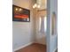 Bright entryway features wood floors, neutral walls, a chandelier and arched entry to another room at 3008 Blue Fin Cir, Las Vegas, NV 89128