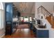 Modern kitchen with custom blue cabinets, stainless steel appliances, wood floors, and a bright window at 3008 Blue Fin Cir, Las Vegas, NV 89128